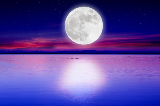 Romantic night with Super moon over lake background.Full moon.