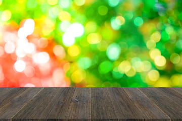 Abstract bokeh background of Christmas tree with wood terrace