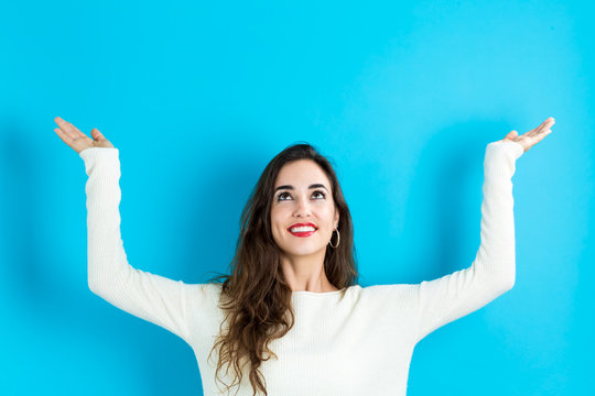 Woman Reaching And Looking Upwards