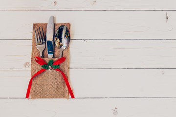 christmas table place setting and silverware, snowflakes on tabl