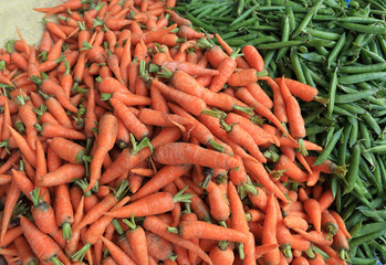 fresh carrots and green peas selling at the street shop