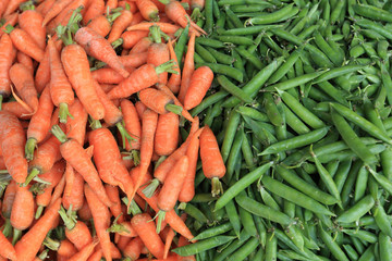 fresh carrots and green peas selling at the street shop