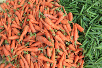 fresh carrots and green peas selling at the street shop