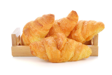 tasty croissant over white background