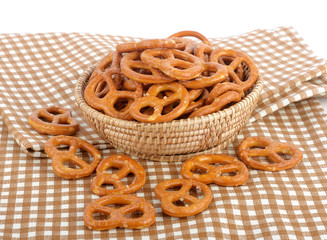 Salted pretzels on white background