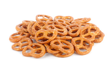 Salted pretzels on white background