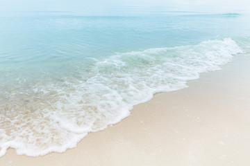 Close up blue sea water waves on white sand beach,Beautiful blue ocean beach close up shot, Clean beach with blue sea in Thailand