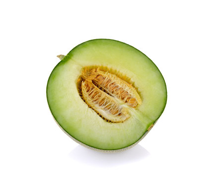 Green cantaloupe melon slices on white