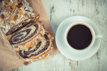 Vintage photo, Portion of poppy seeds cake and cup of coffee, dessert for Christmas