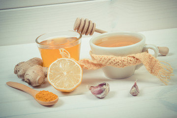 Vintage photo, Cup of tea with lemon and ingredients for preparation warming beverage