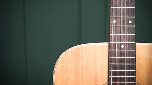 musical background image of acoustic guitar