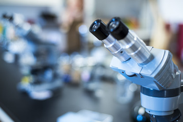 Researching medical facility with a microscopes eye lenses, laboratory research desk counter