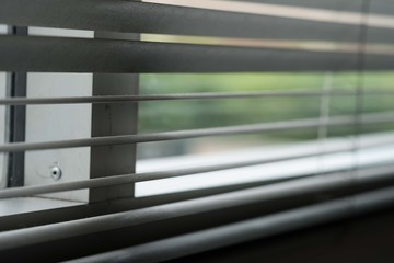 Silhouette of windows blinds against the sun light.