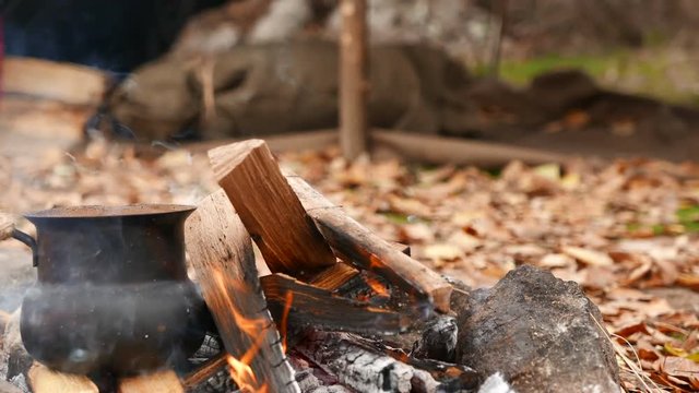 
4K.Camp of  tourist. Hot Coffee, bonfire, and autumn leaves. Dolly shot
