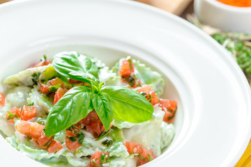 Ravioli pasta from green dough stuffing