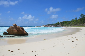 Nice Sandy beach with bright sea and a stone