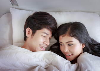Happy Couple On Bed