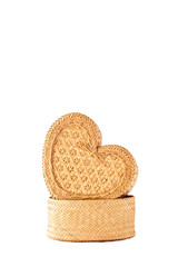 A handmade product, heart-shaped wicker box on white background.