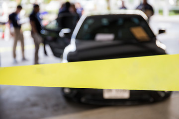 blank police line protect vehicle in crime scene investigation 