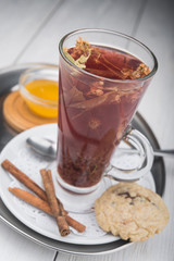 hot tea in glass on wood table
