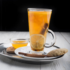 hot tea in glass on wood table