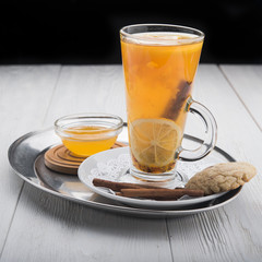 hot tea in glass on wood table
