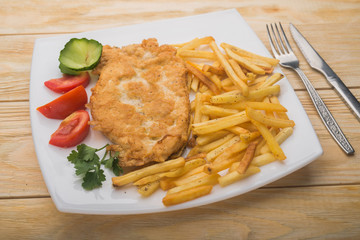 hearty breakfast with boiled potatoes and chicken chop
