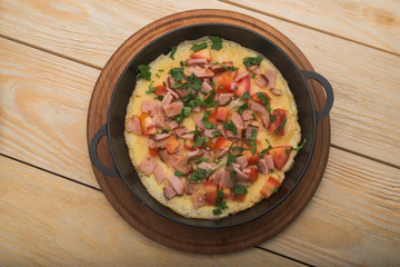 bacon and eggs in a pan