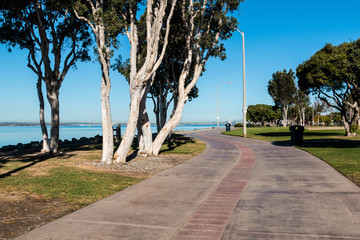 Sidewalk through the Chula Vista Bayfront Park with the San Diego Bay in the background. 