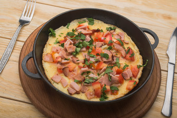 bacon and eggs in a pan