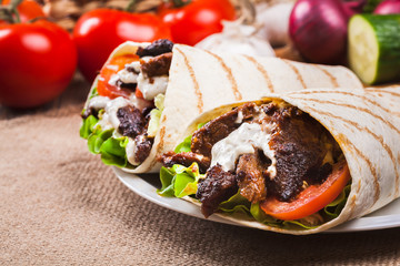 Tasty fresh wrap sandwich with beef and vegetables