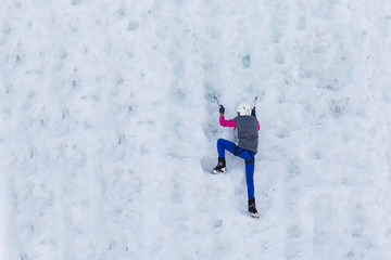 Child climbing frozen waterfall
