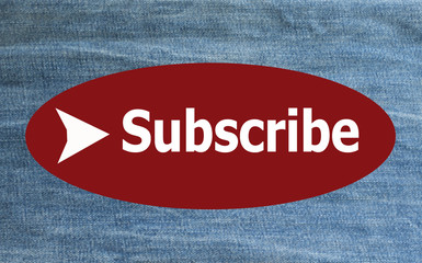 "Subscribe" on blurred jeans background