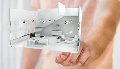 Businessman touching white 3D rendering apartment with his finge