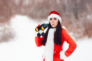 Surprised Girl with Binoculars Looking for Christmas 