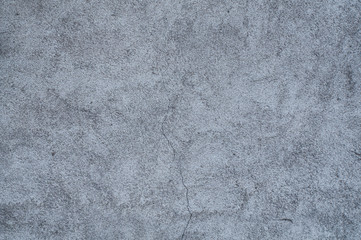Grungy grey concrete wall background.