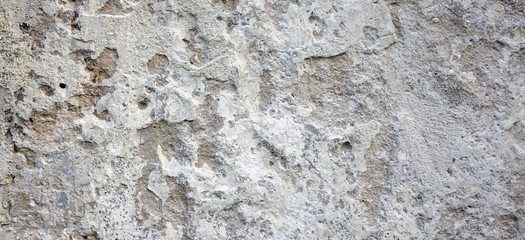 Peeled Plastered Stucco Wall. Cracked White Gray Vertical Textur