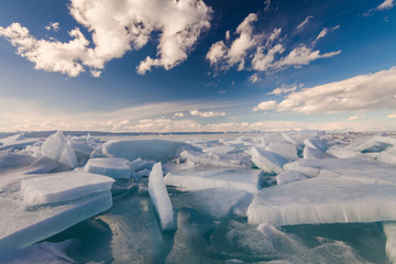 White сracked ice on the Baikal lake