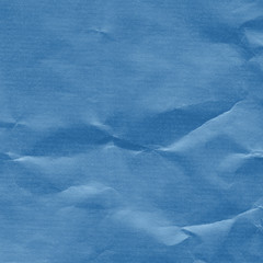 Crumpled recycled blue paper texture background 
