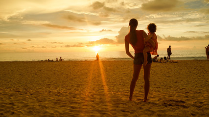 family admiring the sunset