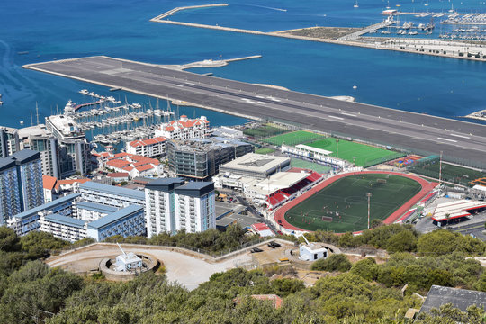 Aerial view of Gibraltar airport runway and La Linea de la Concepcion in Spain
