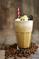 Italian latte with whipped cream and cookies.