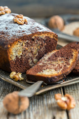 Homemade chocolate cake with walnuts and orange zest.