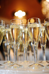 champagne glasses on a background of beautiful interior