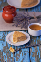 Honey cake on a wooden background