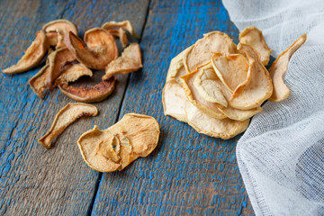 Dried apples and pears in jars. Fruit crisps. Love for a healthy raw food concept