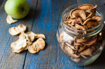 Dried apples and pears in jars. Fruit crisps. Love for a healthy raw food concept