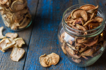 Dried apples and pears in jars. Fruit crisps. Love for a healthy raw food concept