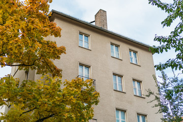 Building made with precast concrete slabs and green tree at Berlin