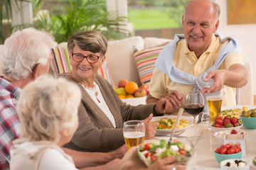 Seniors enjoying an evening meal